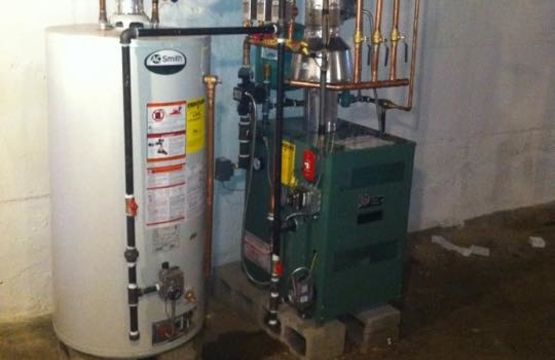 hot water heater next to boiler